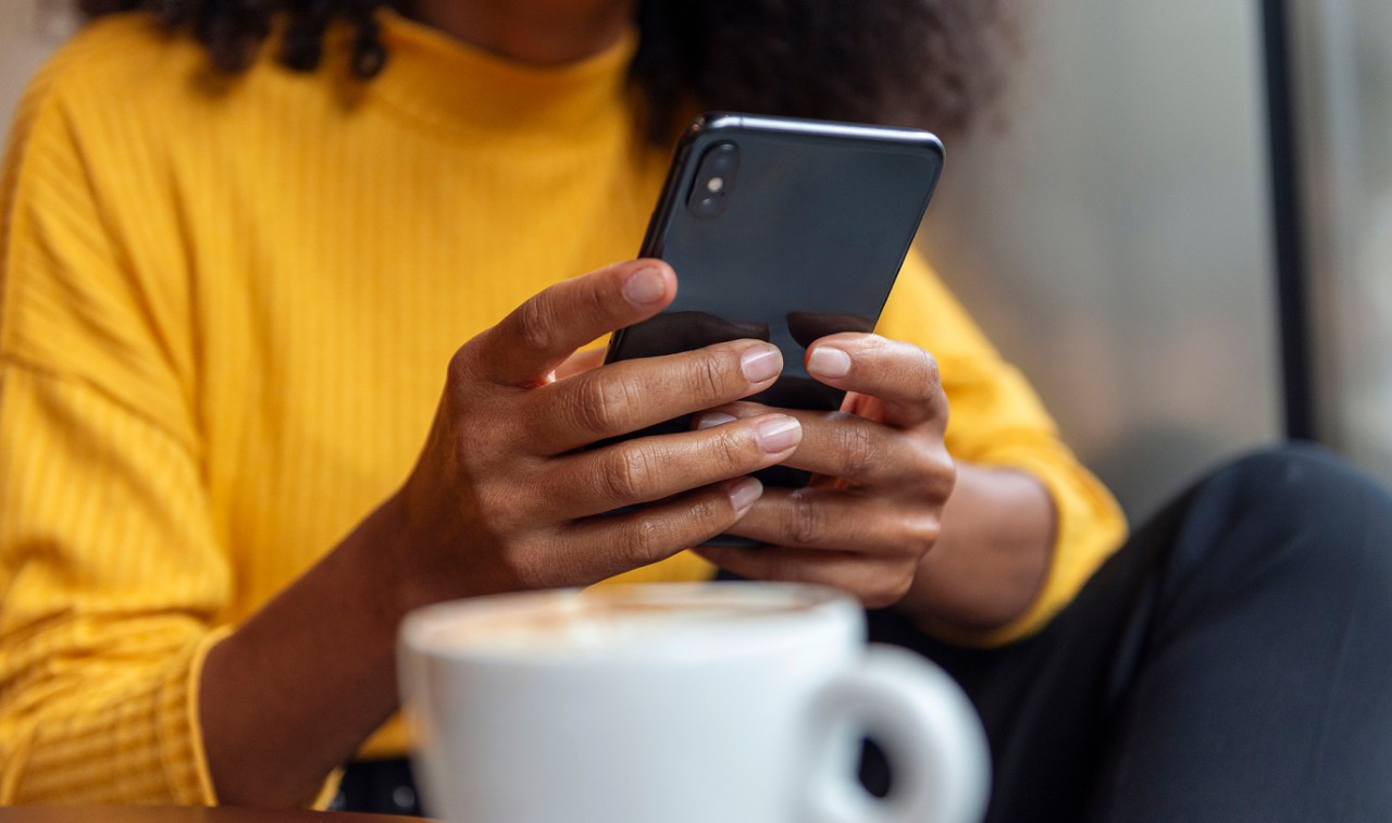 Browsing mobile app with coffee